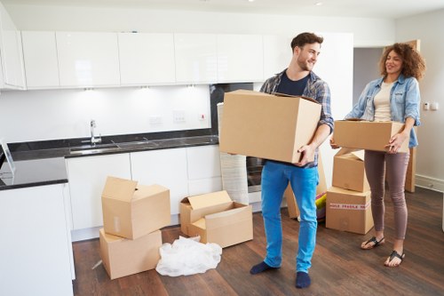 Experienced movers handling office equipment