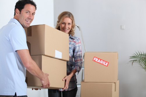 Team of removalists loading furniture into a moving truck